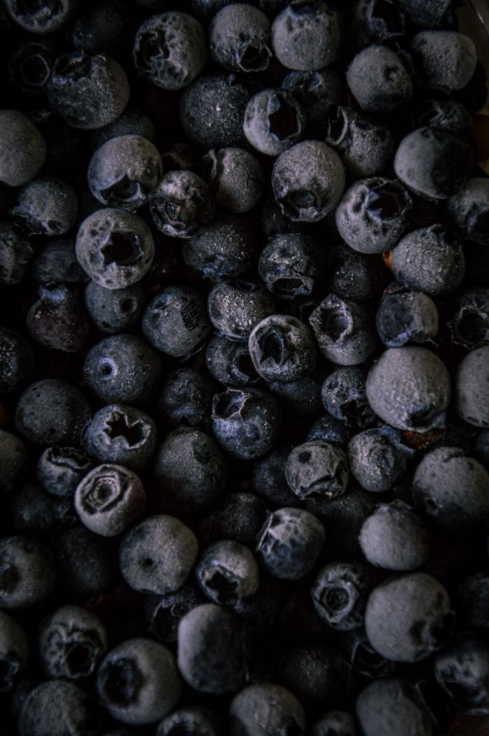 services-02 Detailed close-up of ripe blueberries showcasing their texture and freshness.