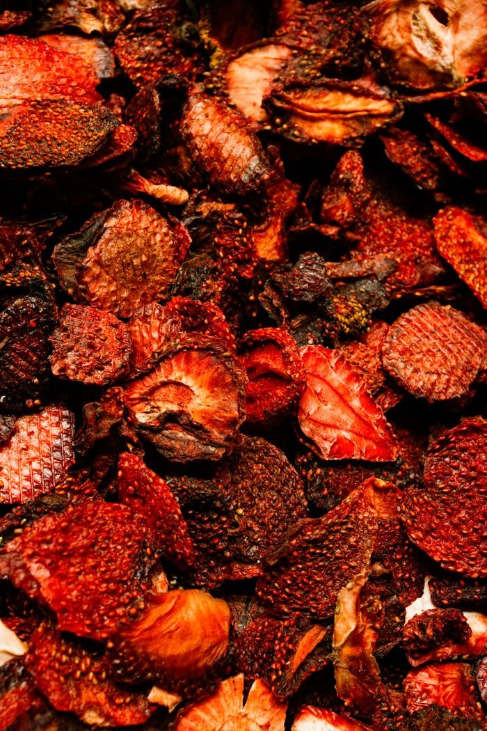 services-03 Vivid collection of dried fruits displaying rich textures and deep colors.