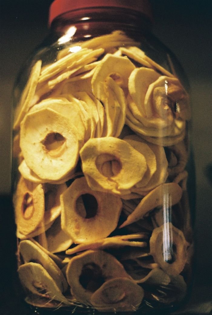 Mastering the First Impression: Your intriguing post title goes here Close-up of a glass jar filled with homemade dried apple slices - a healthy snack option.